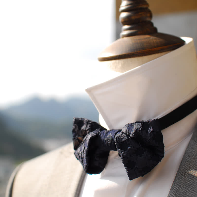 Pajarita elegante con estampado floral en jacquard negro para hombre