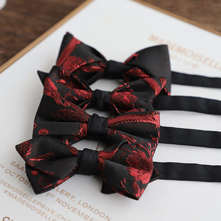 Pajarita negra con estampado floral rojo para hombre