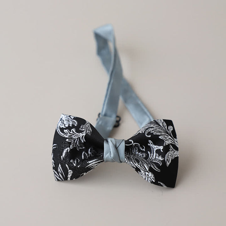 Pajarita con bordado floral en blanco y negro para hombre