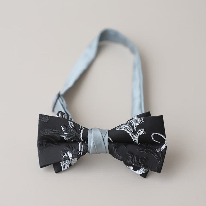 Pajarita con bordado floral en blanco y negro para hombre