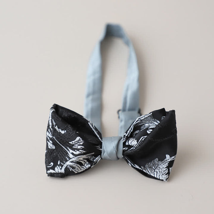 Pajarita con bordado floral en blanco y negro para hombre