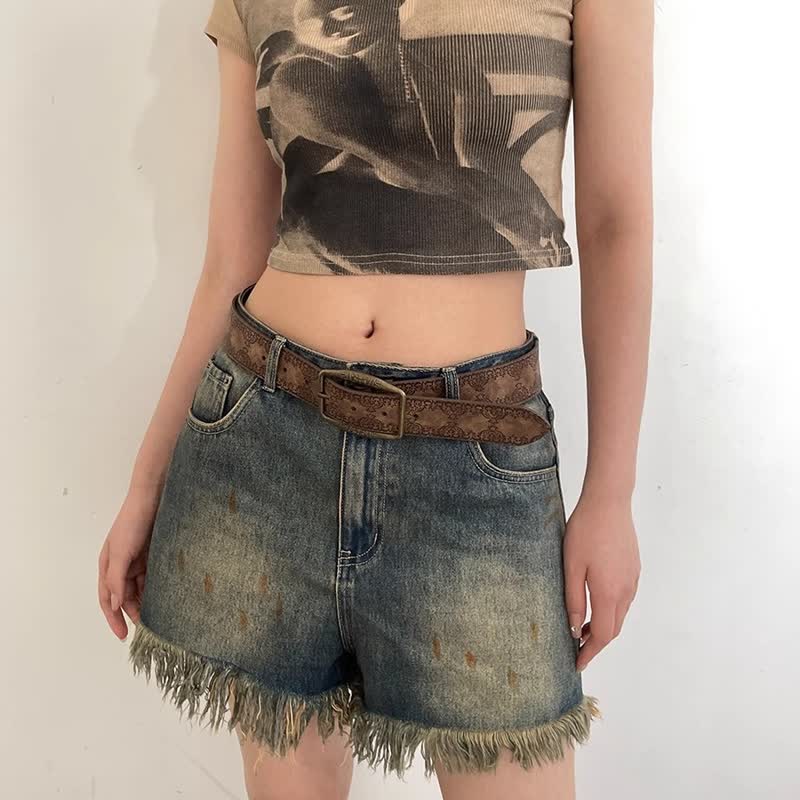 Cinturón de piel con estampado grabado en color marrón oscuro para mujer