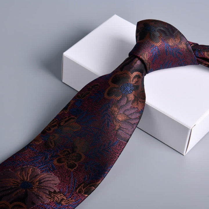 Corbata de hombre con estampado de hojas y flores en burdeos y azul marino