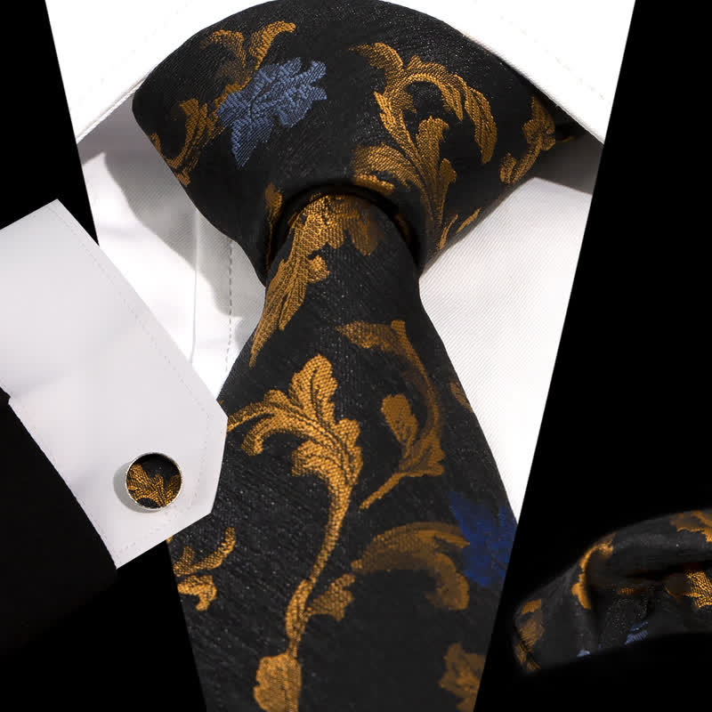 Conjunto de 3 corbatas para hombre con diseño de hojas negras y doradas y flores azules.