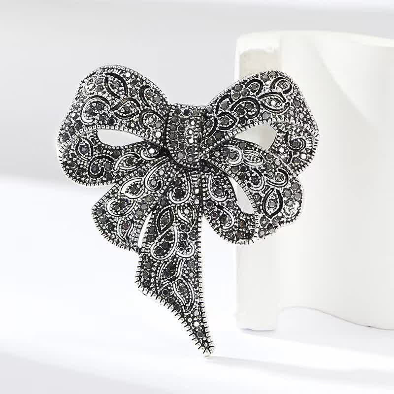 Broche de plata antigua con forma de lazo y diamantes de imitación para mujer