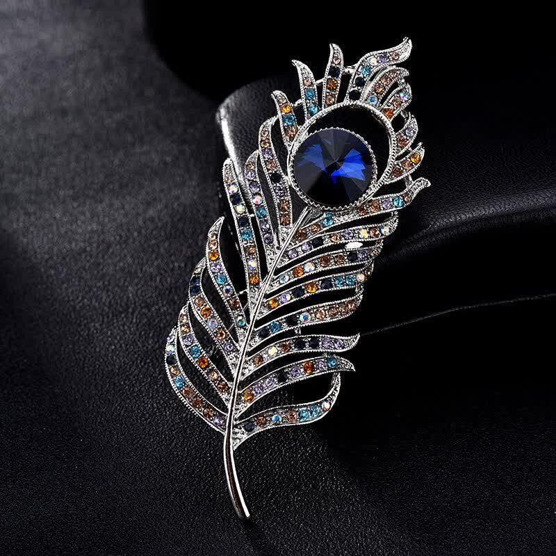 Broche unisex con forma de pluma de fénix y diamantes de imitación de colores.