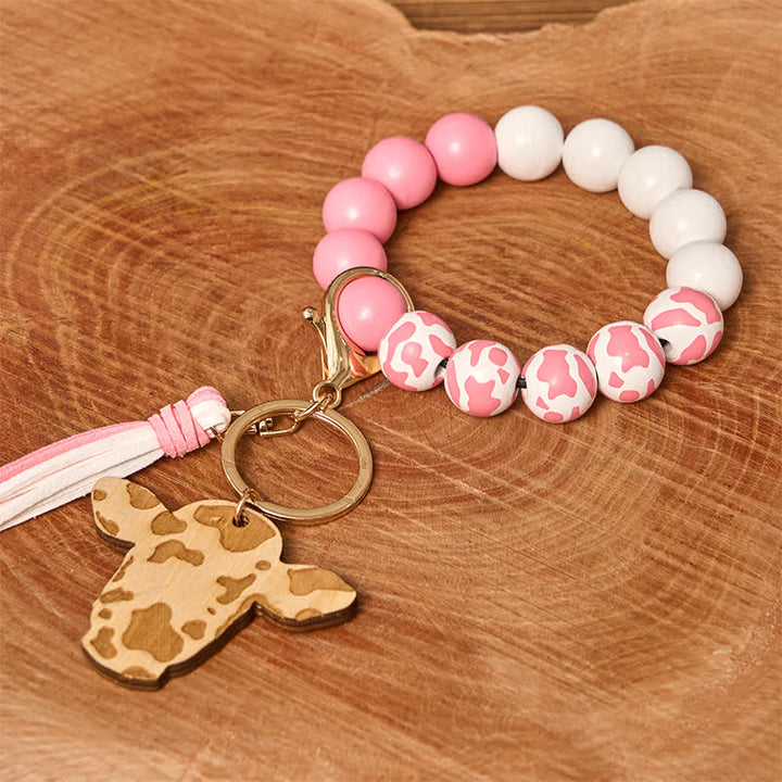 Pulsera estilo western con cuentas de madera de vaca y borla