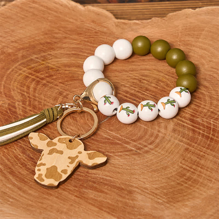 Pulsera estilo western con cuentas de madera de vaca y borla