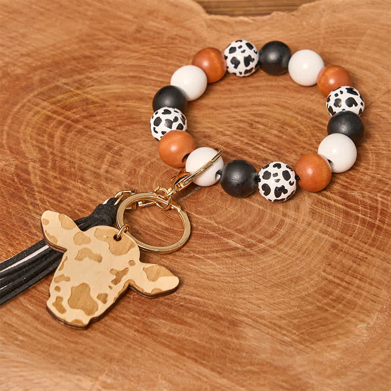 Pulsera estilo western con cuentas de madera de vaca y borla
