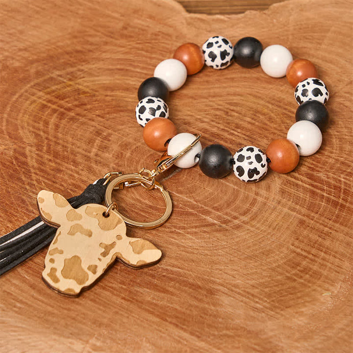 Pulsera estilo western con cuentas de madera de vaca y borla