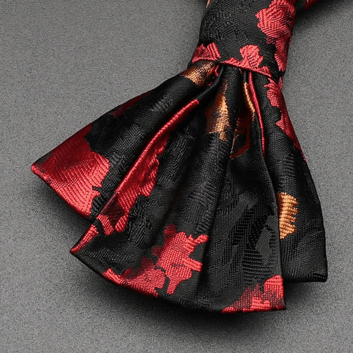 Pajarita con estampado floral en rojo y negro para hombre
