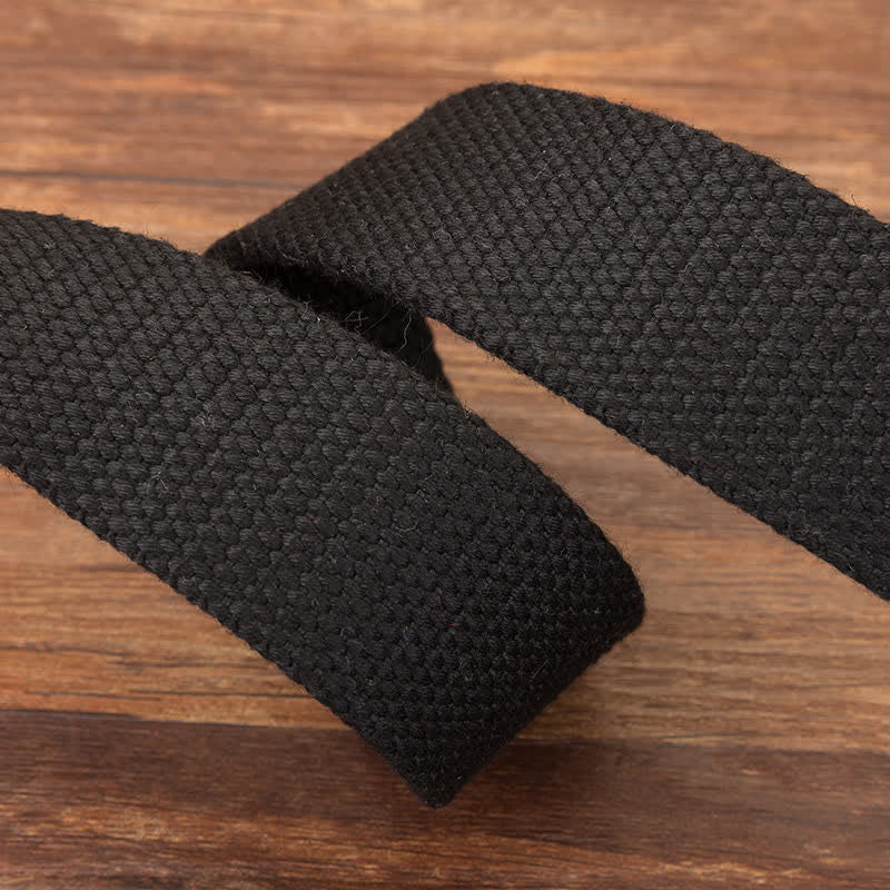 Cinturón de lona tejida con hebilla automática de calavera para hombre