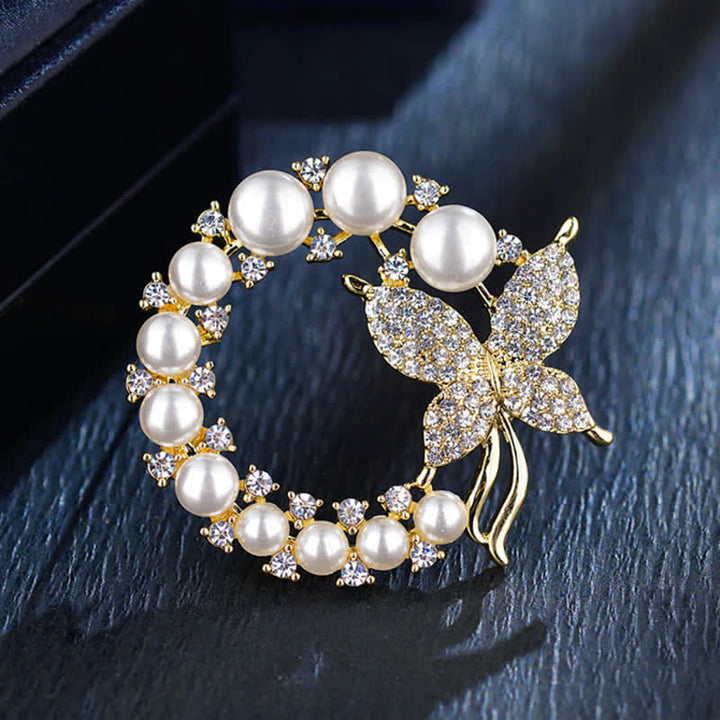 Broche de mariposa dorada con corona de perlas para mujer