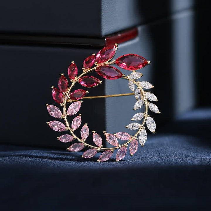 Broche de hojas de trigo doradas y circonitas para mujer