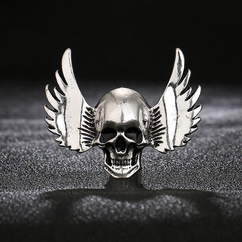 Broche de calavera sonriente con alas para hombre