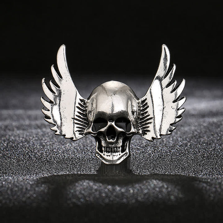 Broche de calavera sonriente con alas para hombre