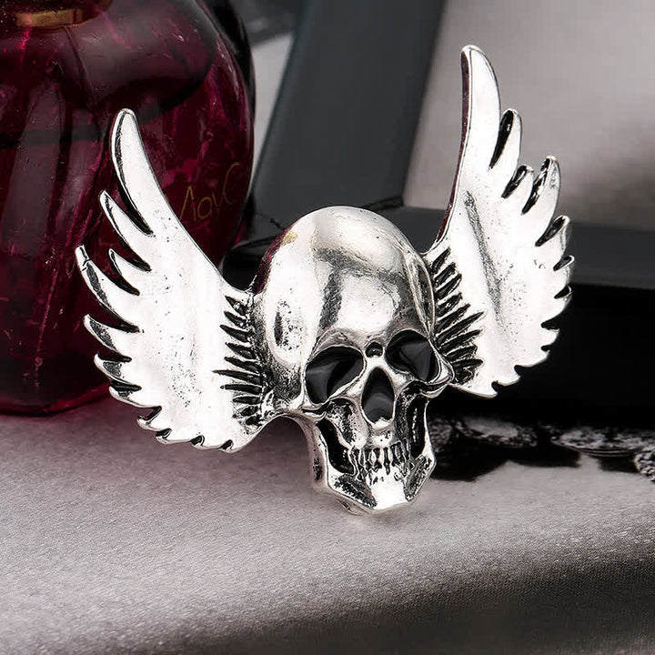 Broche de calavera sonriente con alas para hombre
