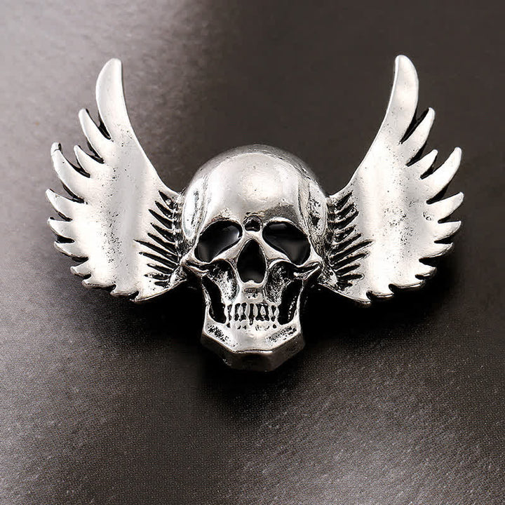 Broche de calavera sonriente con alas para hombre