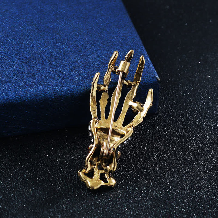 Broche de diamantes de imitación con forma de mano de esqueleto para hombre