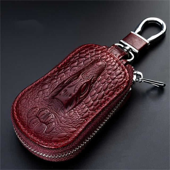 Estuche para llaves de coche de cuero con cremallera y diseño de cocodrilo.
