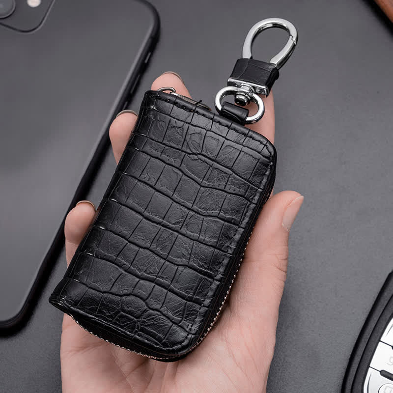 Estuche de cuero para llaves de coche con cremallera y diseño de cocodrilo.