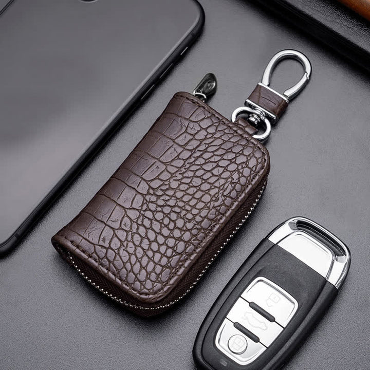 Estuche de cuero para llaves de coche con cremallera y diseño de cocodrilo.