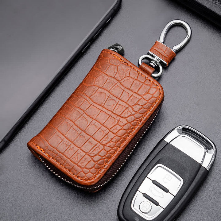 Estuche de cuero para llaves de coche con cremallera y diseño de cocodrilo.