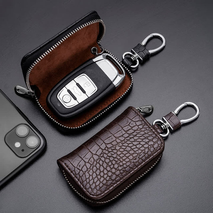 Estuche de cuero para llaves de coche con cremallera y diseño de cocodrilo.