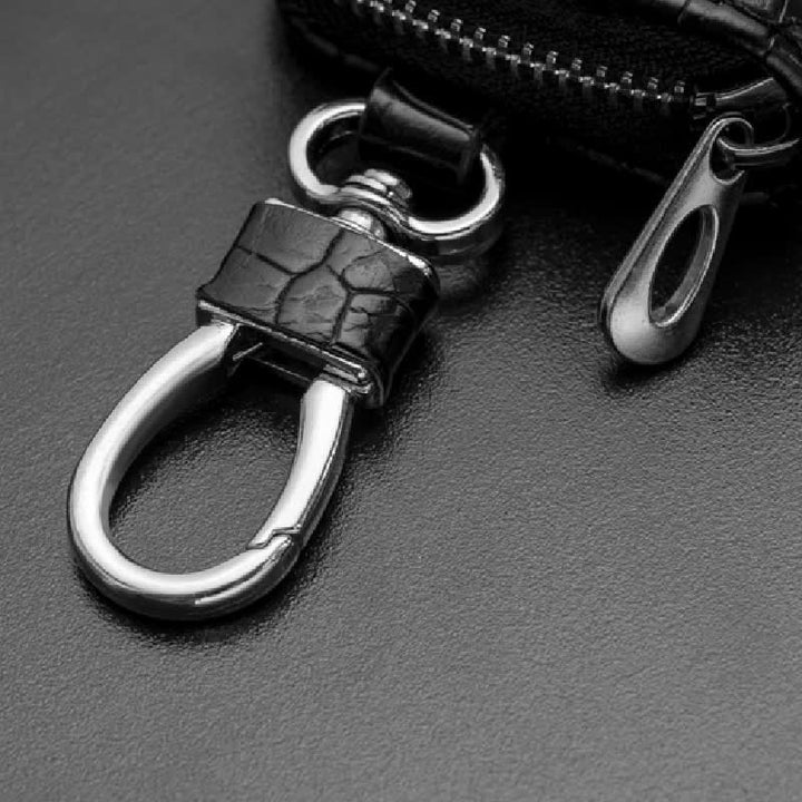 Estuche de cuero para llaves de coche con cremallera y diseño de cocodrilo.