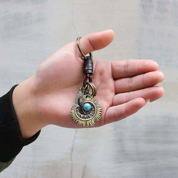 Llavero de cuero turquesa artificial azul con cola de fénix - image 1