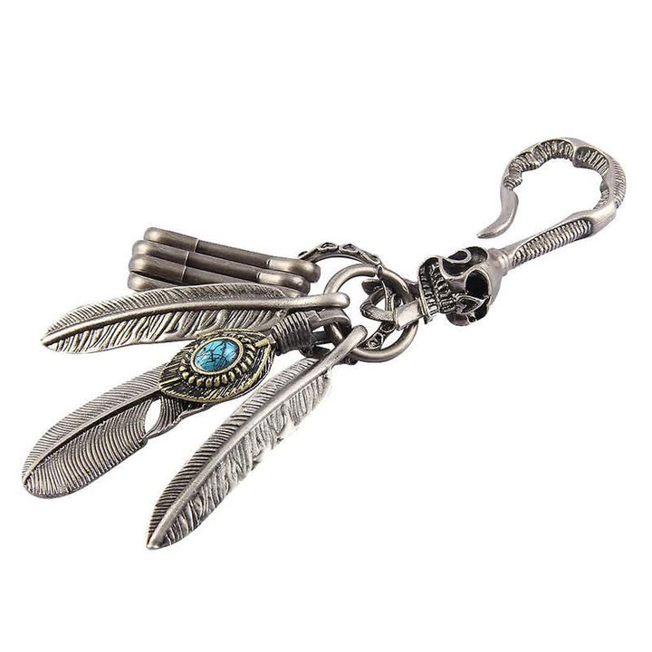 Llavero de cuero turquesa azul con plumas de calavera estilo boho