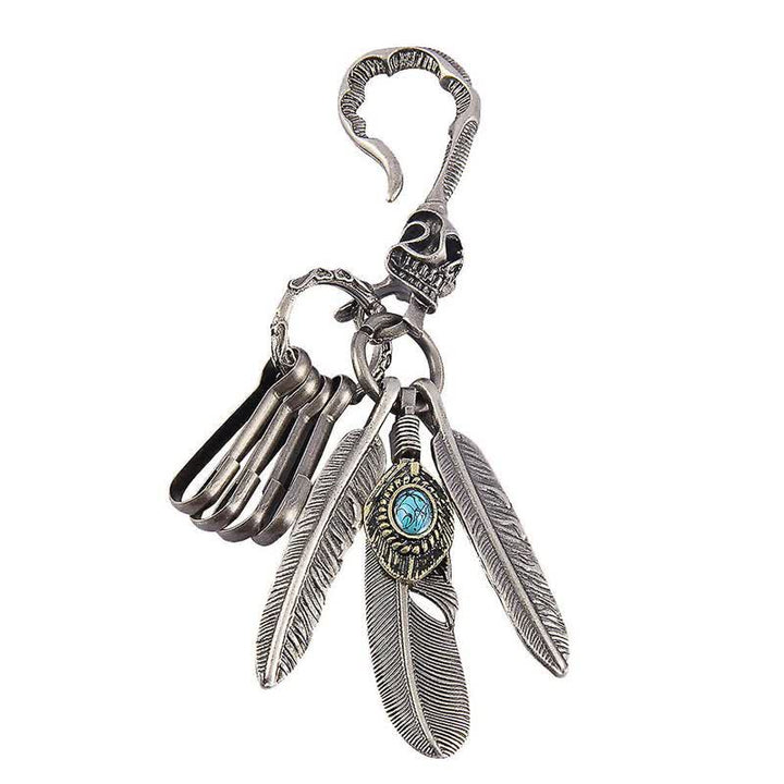 Llavero de cuero turquesa azul con plumas de calavera estilo boho