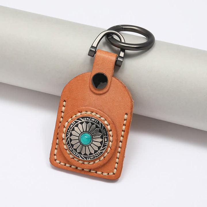 Encantador llavero de cuero turquesa con flor bohemia