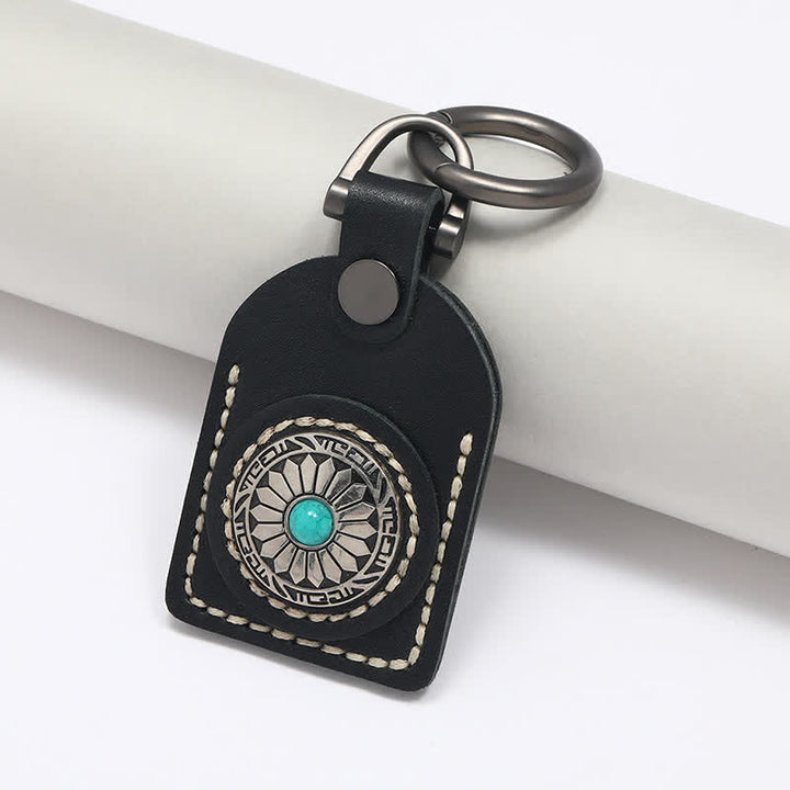 Encantador llavero de cuero turquesa con flor bohemia