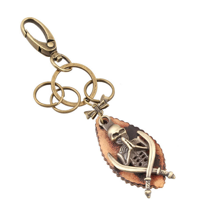 Llavero de cuero bañado en bronce con diseño de esqueleto punk
