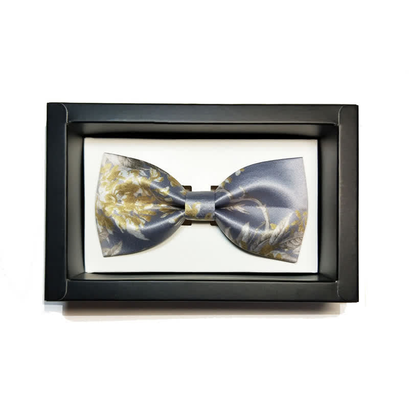 Pajarita elegante con estampado floral en gris, amarillo y blanco para hombre