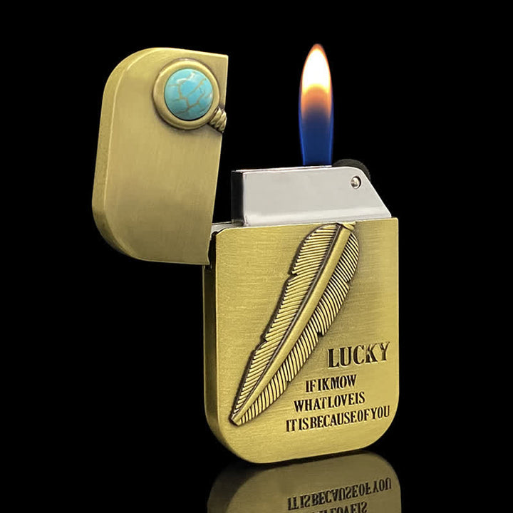 Encendedor de butano recargable con efecto turquesa y diseño de plumas