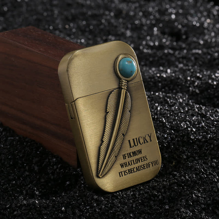 Encendedor de butano recargable con efecto turquesa y diseño de plumas