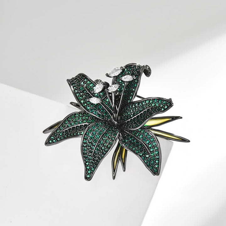 Broche de mujer con incrustaciones de circonitas y cristales de lirio verde oscuro