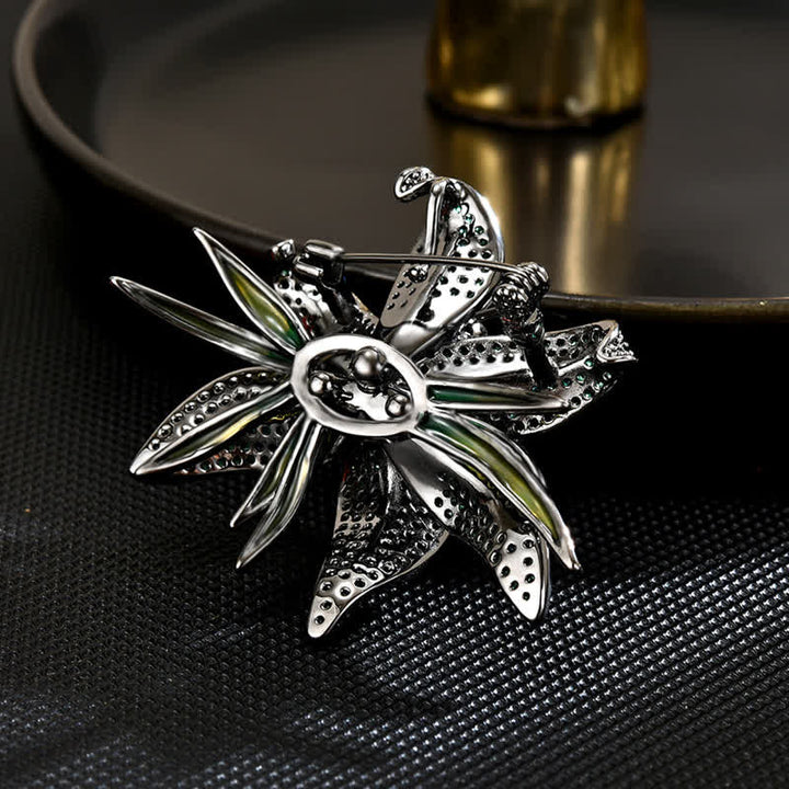Broche de mujer con incrustaciones de circonitas y cristales de lirio verde oscuro