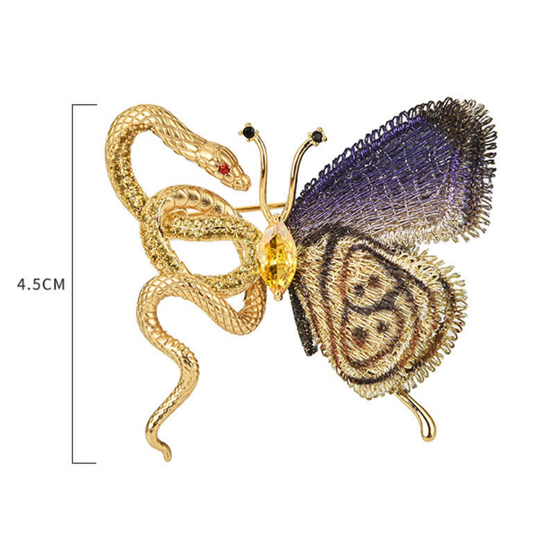 Broche de mujer con mariposa bordada en morado y serpiente dorada