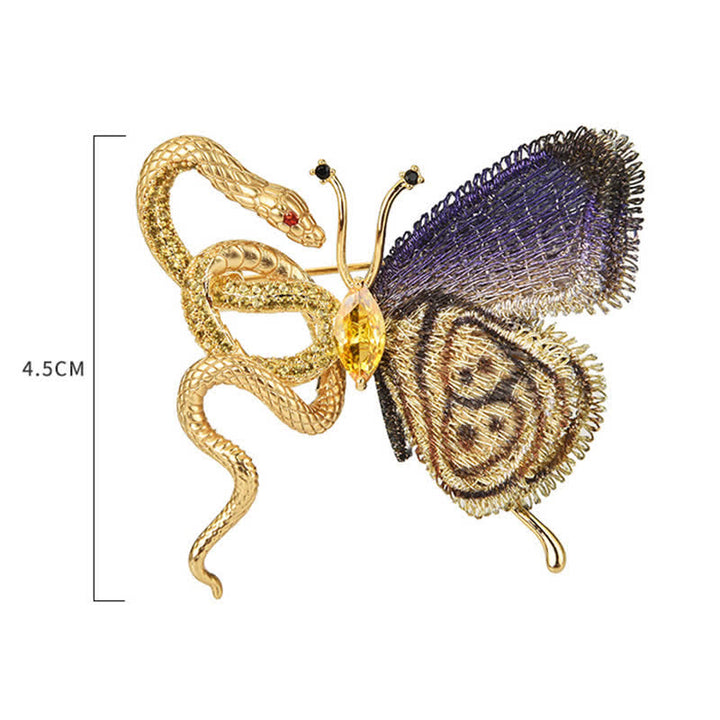 Broche de mujer con mariposa bordada en morado y serpiente dorada