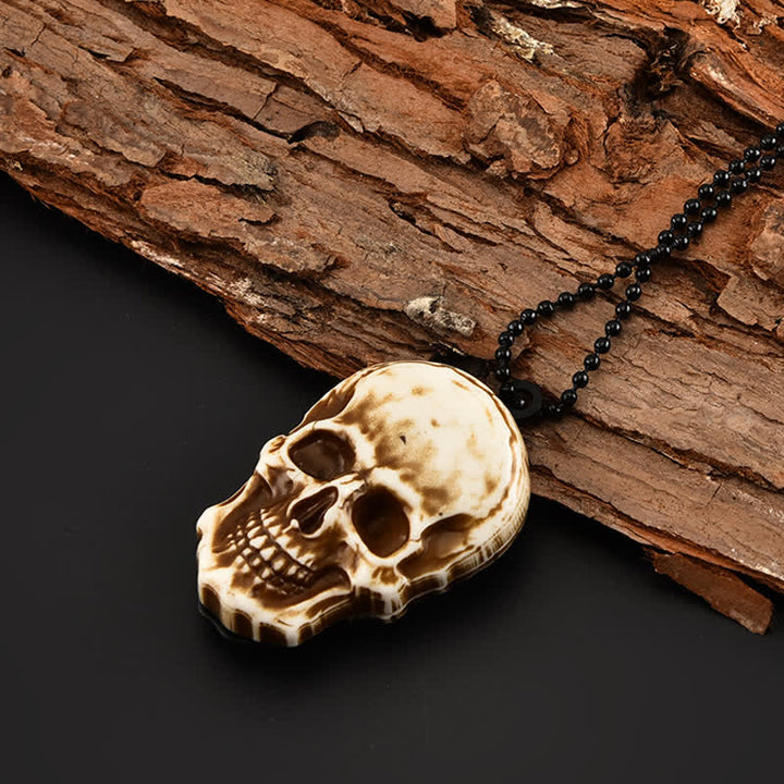 Mini cuchillo plegable con diseño de calavera creativa y llavero con cadena.