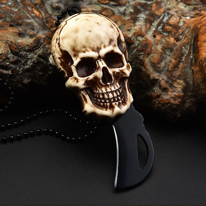 Mini cuchillo plegable con diseño de calavera creativa y llavero con cadena.