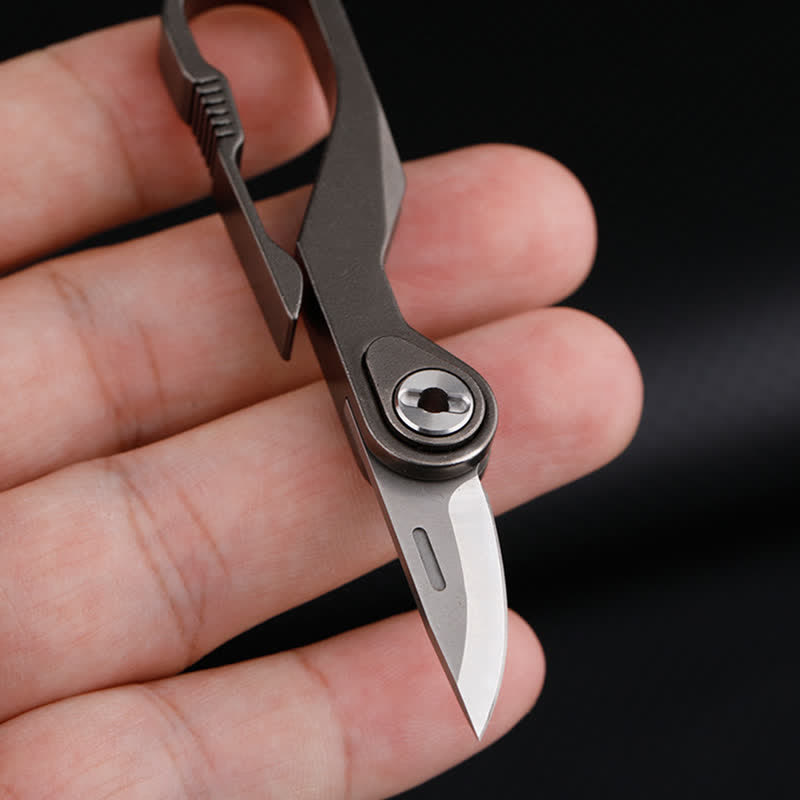 Mini navaja plegable de titanio con llavero y cortador de cajas