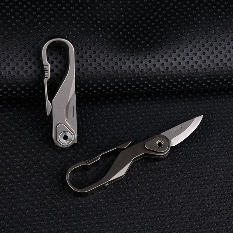 Mini navaja plegable de titanio con llavero y cortador de cajas