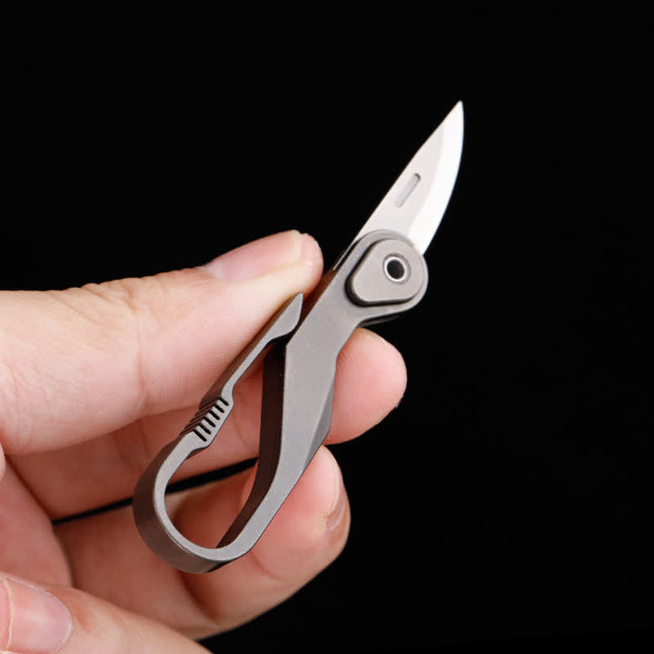 Mini navaja plegable de titanio con llavero y cortador de cajas
