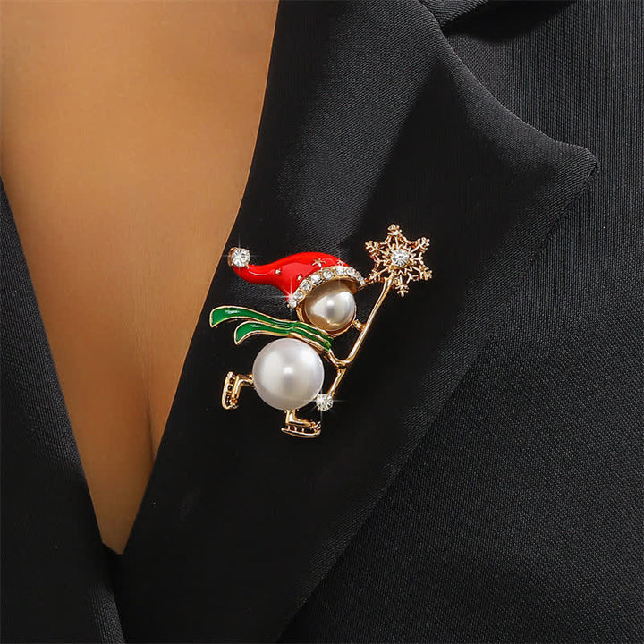 Broche navideño con gorro de Papá Noel rojo y muñeco de nieve para mujer