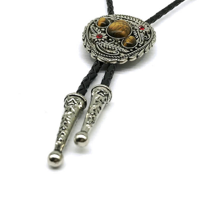 Corbata de bolo con incrustaciones de tres piedras y flores talladas