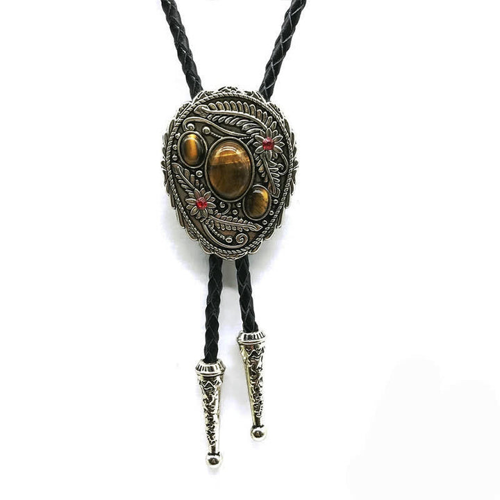 Corbata de bolo con incrustaciones de tres piedras y flores talladas